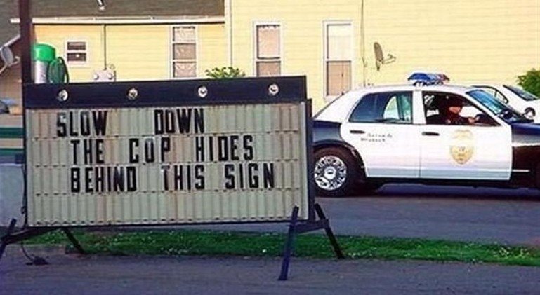 Cop-Hides-Behind-This-Sign%20(Medium).jpg