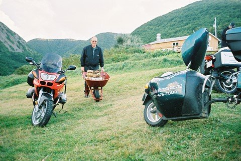 Ron brings wood at Meat Cove.JPG