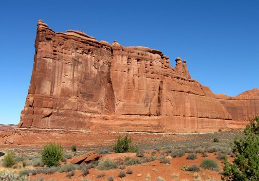 Huge sandstone cliff at Arches NP sm.jpg