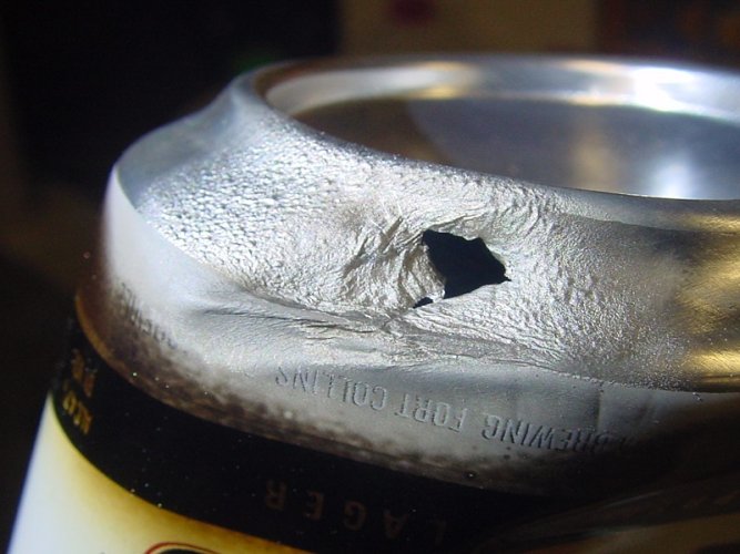 al beer can with melted hole-1.jpg